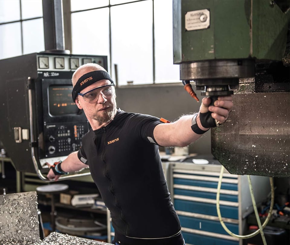 Worker at an industrial plant wearing Xsens Awinda suit