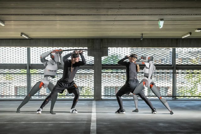 Mocap model fighting in a parking garage with their avatars