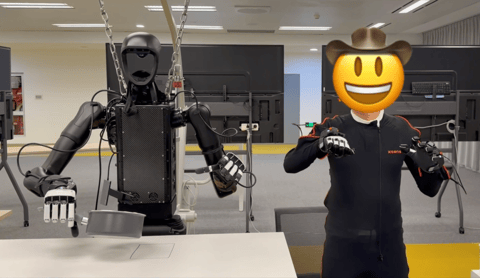 TeleOpBench research subject wearing Xsens Link next to a robot